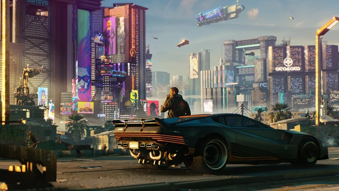The protagonist of Cyberpunk 2077 sitting on the hood of their car as they look out over Night City.