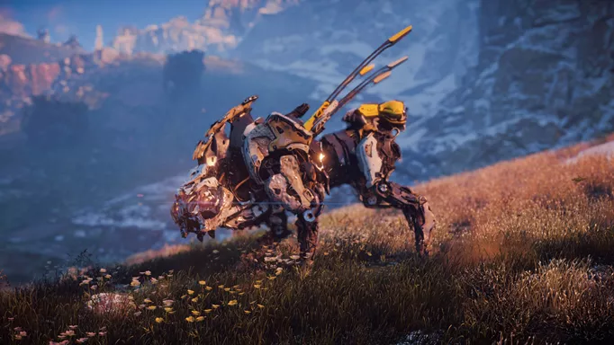 a dog-like robot from horizon forbidden west stalks along a grassy plain