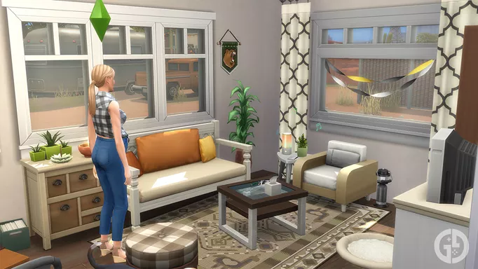 Image of a pregnant Sim listening to music in The Sims 4
