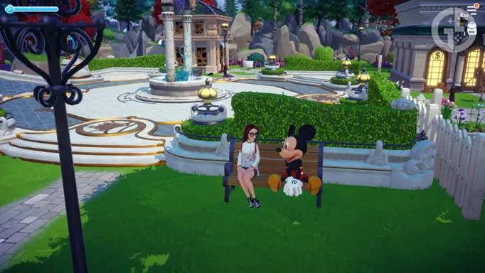 Mickey sitting on a bench in Disney Dreamlight Valley