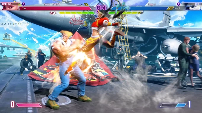 Image shows Kimberly using her kick on Guile, who is attempting to block it in Street Fighter 6