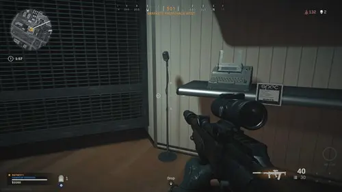 Secrets of the Pacific Warzone locations holds a microphone.
