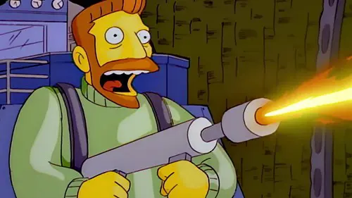 Hank Scorpio firing a flamethrower in The Simpsons