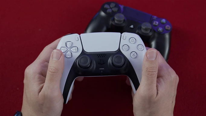 A person holding the PS5's Dualsense in their hands as a PS4 controller sits in the background.