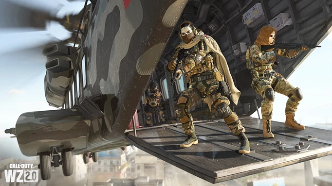 Players fight from the back of a helicopter in Warzone.