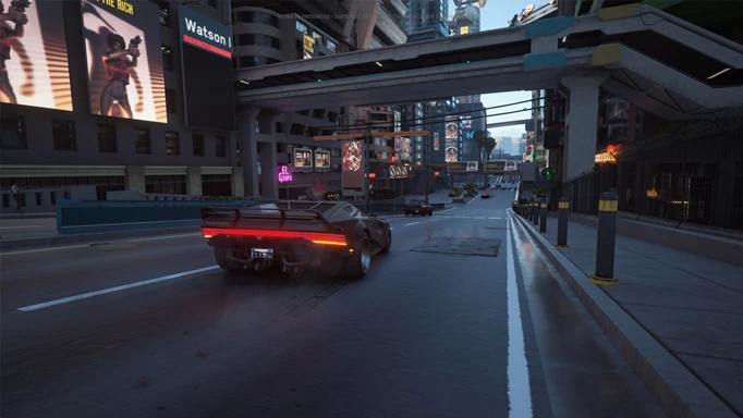 A car driving down a street in Night City in Cyberpunk 2077 with the E3 visuals mod