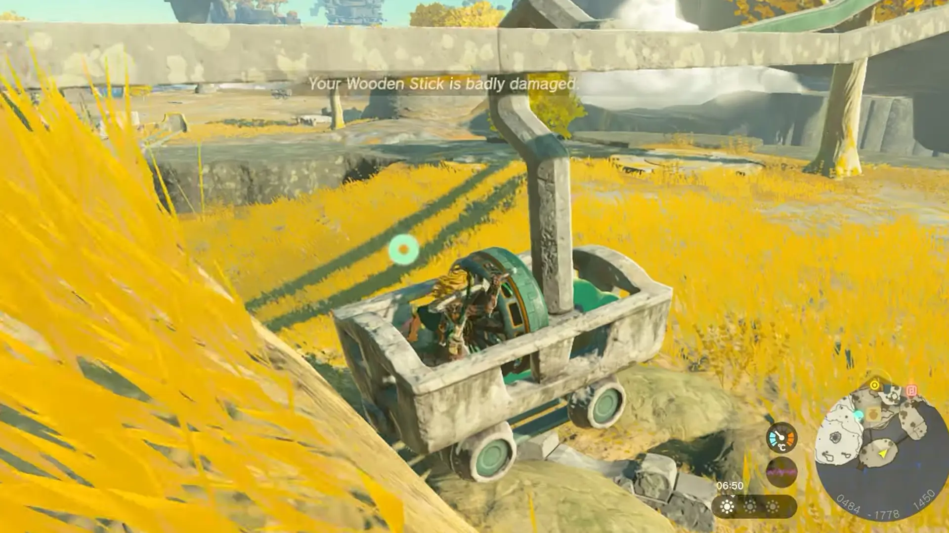 Crossing the Zelda TOTK broken rail by attaching a hook to a mine cart and a fan