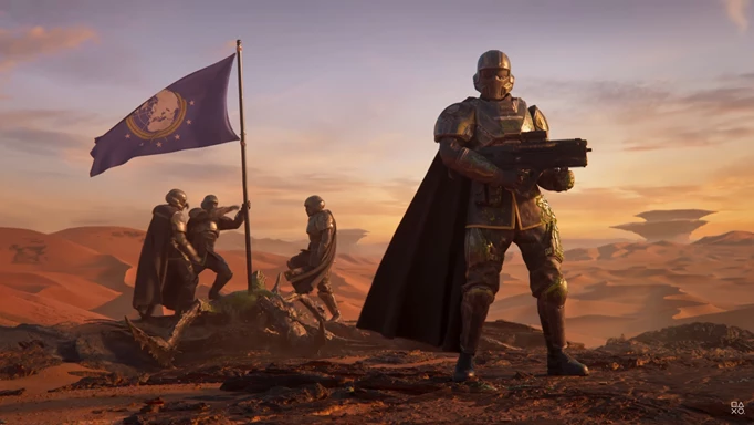 A Helldivers squad raise a flag in Helldivers 2.