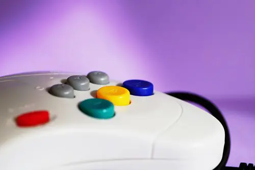 A close-up shot of a colourful Sega Saturn controller.