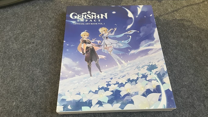 The Genshin Impact Official Art Book Vol. 1 in its slipcase.
