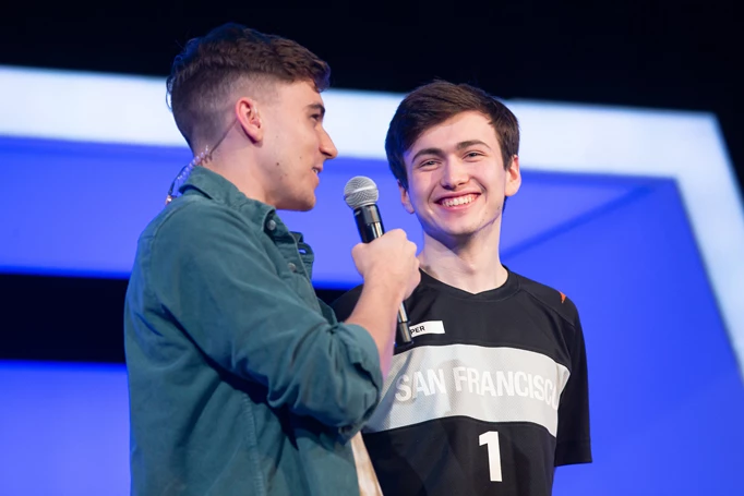 Former pro player turned caster Jake interviewing super on stage whose grinning wide
