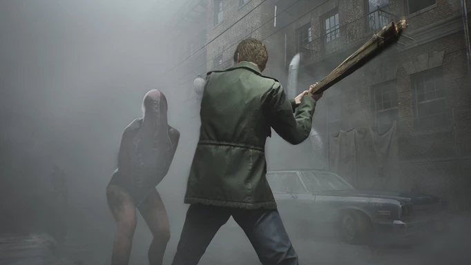 James Sunderland swings a baseball bat at an enemy lurking in the fog in Silent Hill 2's remake.