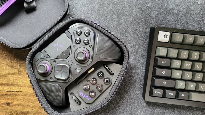 Image of the Victrix Pro BFG controller in its case next to a keyboard