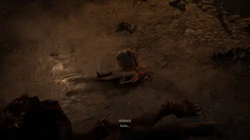 Donan grieving over his son's body in Diablo 4