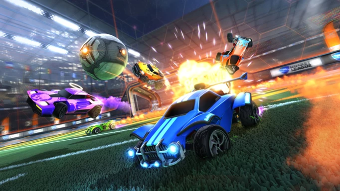 Rocket League cars chasing the ball, while an explosion happens in the background