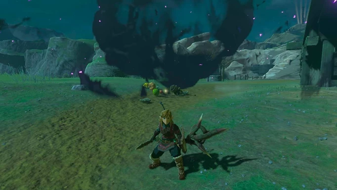 Link standing in front of a defeated Hinox in Tears of the Kingdom