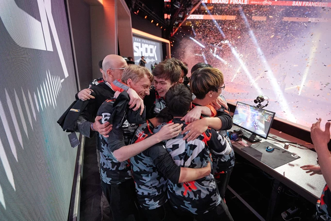Shock huddle after winning the season 2 grand finals. Also pictured, CEO of Shock's parent company NRG Esports.