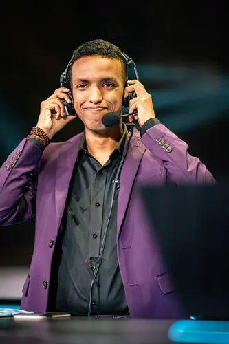 A League announcer taking off his headphones