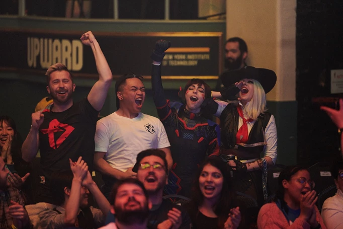Toronto Defiant fans cheering, some of them in cosplay