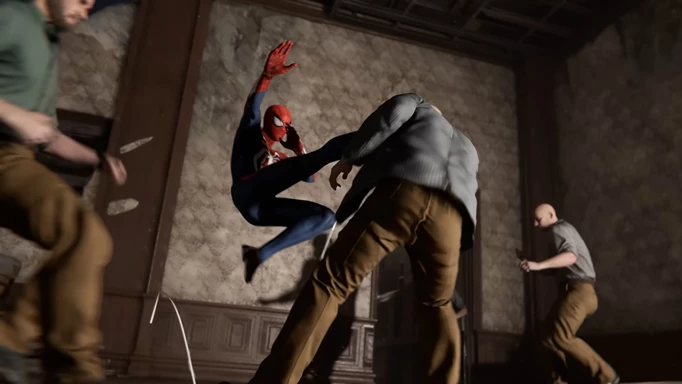 Spider-Man kicking a regular man in his face