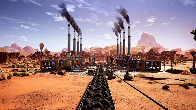 Coal stretches down a travel line into a collection of factory buildings in Satisfactory.