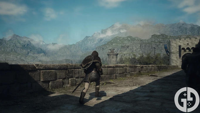 Image of the player walking across a bridge with mountains in the distance in Dragon's Dogma 2
