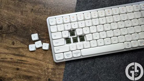 Image of the Lofree Flow with the WASD keycaps removed, exposing the switches underneath