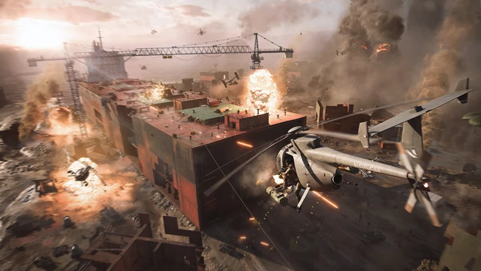 A helicopter flies over a ruined ship.