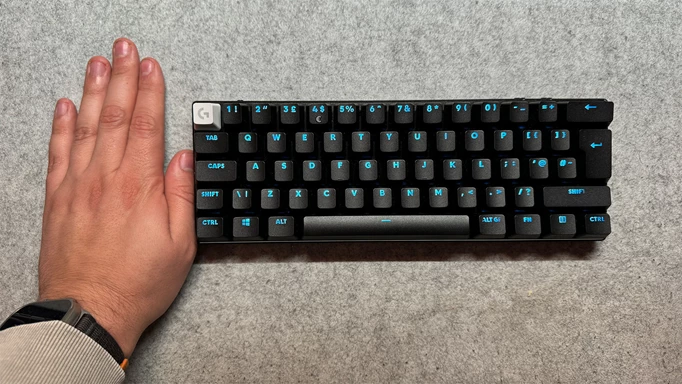 Logitech PRO X 60 keyboard next to reviewer's hand