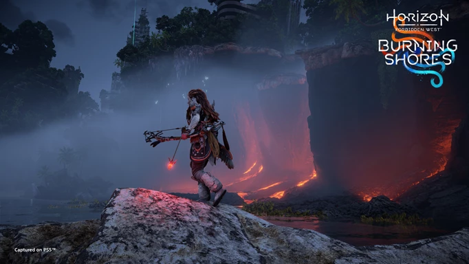 Aloy standing on a cliff looking out across the Burning Shores