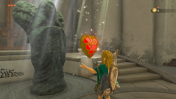 Image shows Link receiving a heart container from the goddess statue in Zelda: Tears of the Kingdom