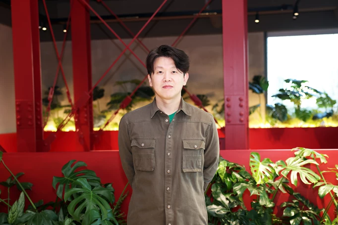 Taeseok Jang of PUBG Studios standing in front of a red background