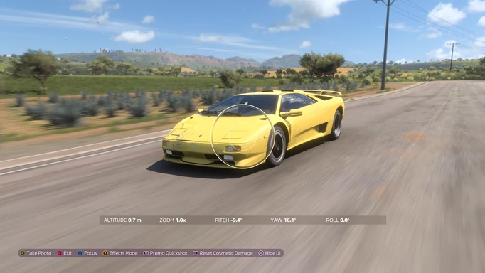 A photo mode taking a picture of a yellow car.