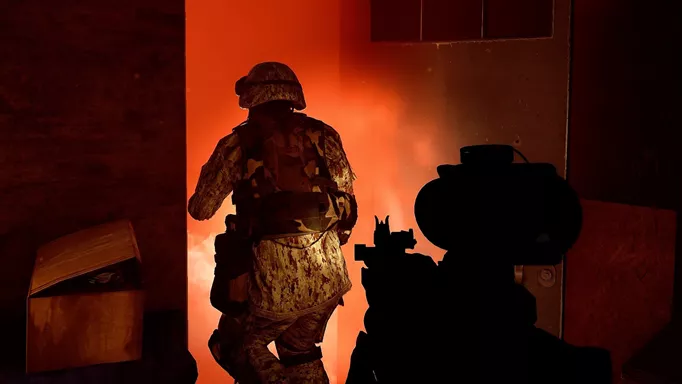 Soldiers walk into a burning room in Six Days in Fallujah.