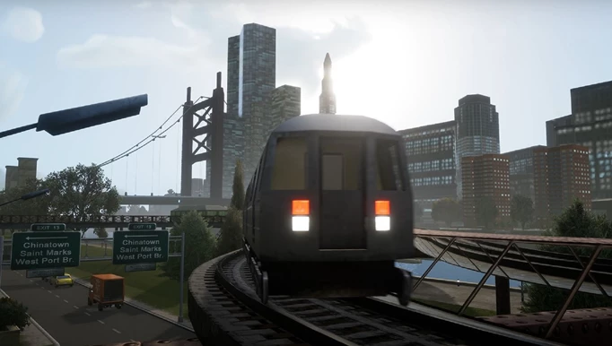 a train passes on a railway with a city in the background