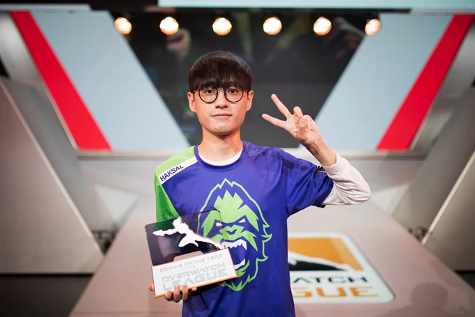 Haksal holding his Rookie of the Year trophy