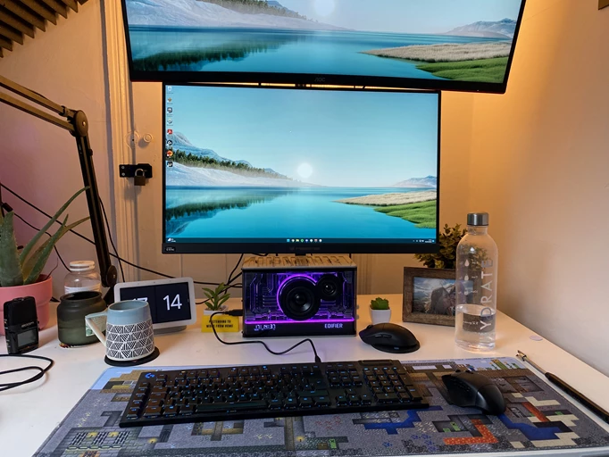 The Edifier QD35 sitting on a desk beneath two monitors