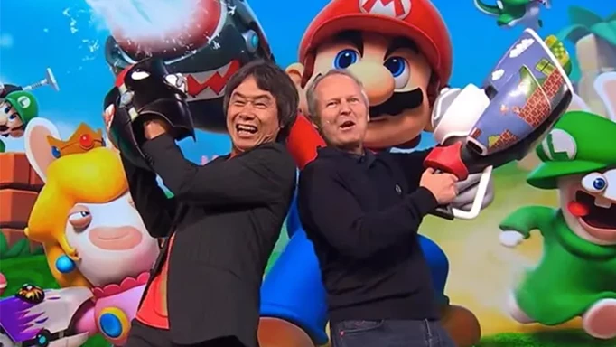 Miyamoto onstage at E3 2017 to reveal Mario + Rabies Kingdom Battle alongside Ubisoft CEO Yves Guillemot.