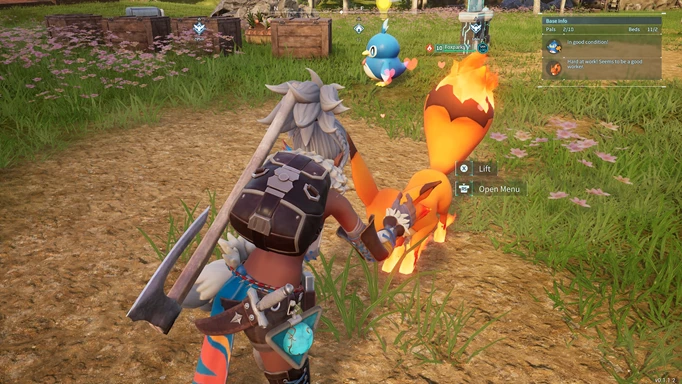 palworld player petting their foxparks, an orange foox with a firey tail
