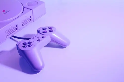A shot of the front of a PS1 and its controller.