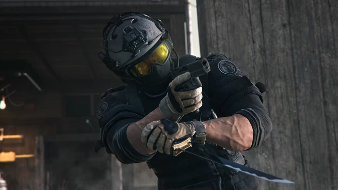 Operator holding a pistol