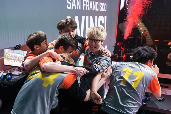 The Shock players in a chaotic huddle moments after winning the season 2 stage 2 playoffs