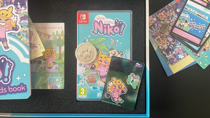 The game box, Friend Token and a trading card from Super Rare Games' Here Comes Niko! Collector's Edition.